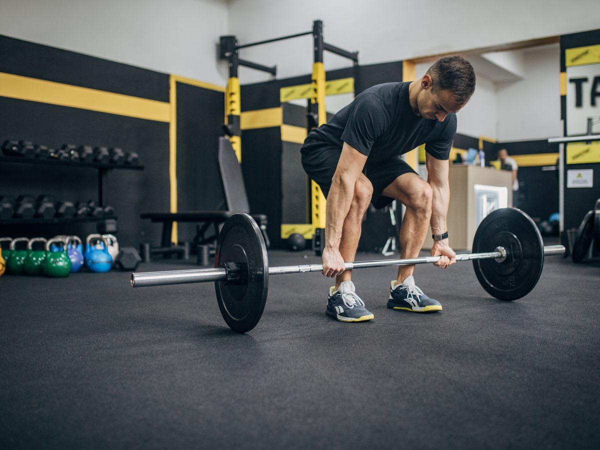 Conventional Deadlift, a muscle-building barbell exercise for lats.