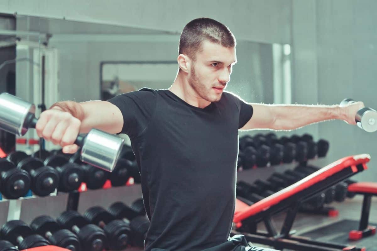 26 Best Standing Dumbbell Exercises to Build Muscle dumbbell side delt raise