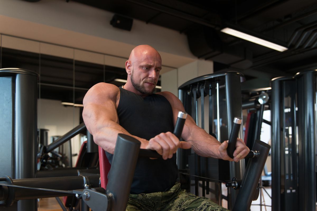 Gym Machine Chest Workout: 8 Best Exercises & Training Plan Seated Machine Low Chest Press for Developing Lower Pecs